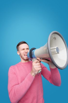 man talking on a megaphone