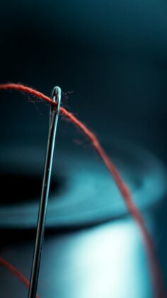 red thread in a needle