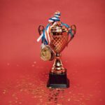 medals tied on a trophy