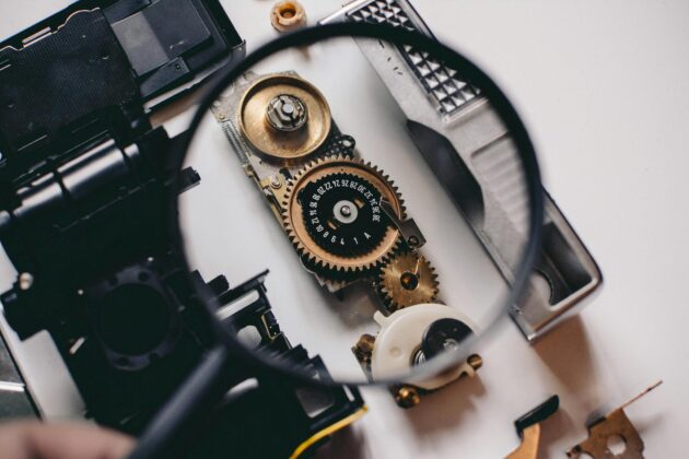 shallow focus photography of magnifying glass with black frame