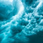 underwater view of the seafoam and waves