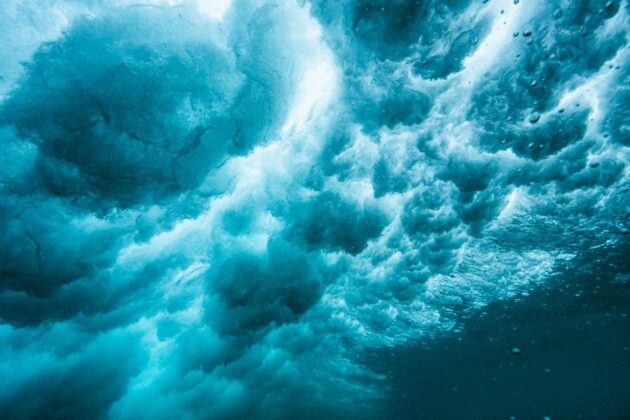 underwater view of the seafoam and waves