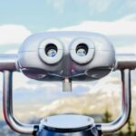 gray and black binoculars on top of the mountain